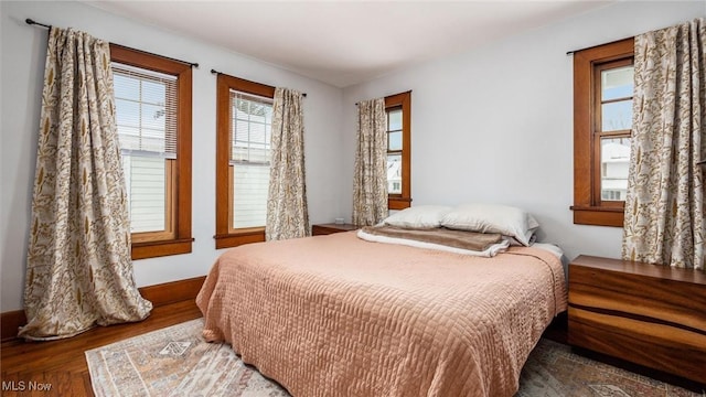 bedroom featuring dark hardwood / wood-style flooring