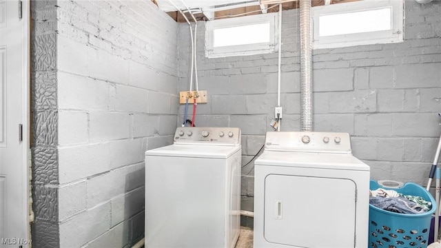 laundry area with washing machine and clothes dryer