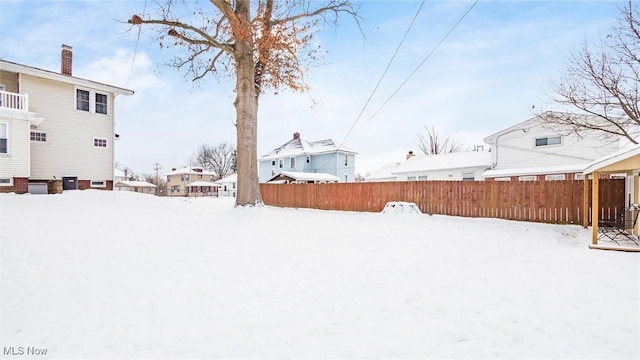 view of yard layered in snow