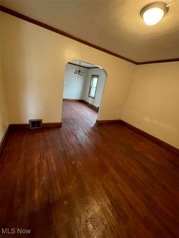 additional living space with hardwood / wood-style flooring