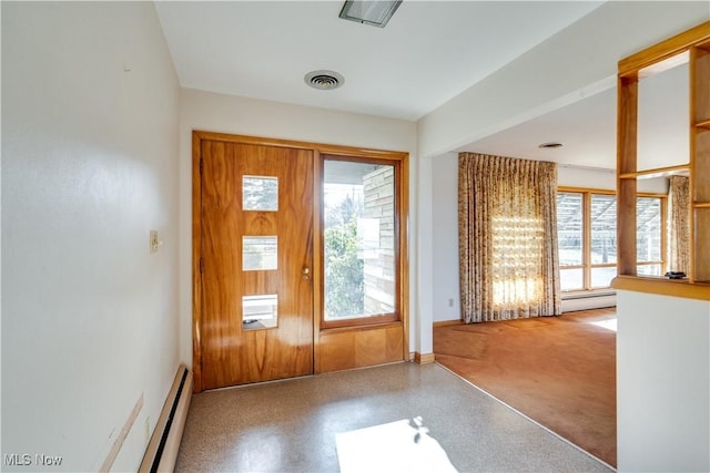 foyer with a baseboard heating unit