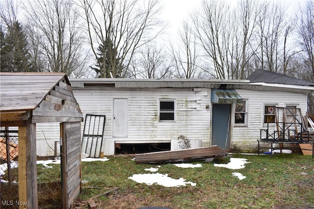 back of house with a yard