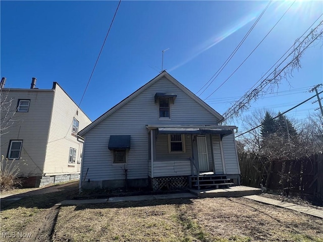 back of property with fence