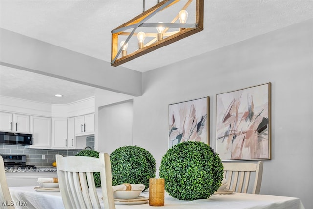 dining area featuring a textured ceiling