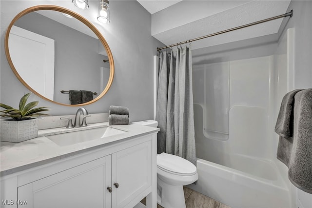 full bathroom with toilet, vanity, and shower / tub combo with curtain