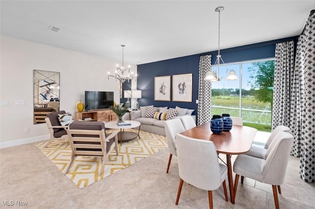 dining room featuring a notable chandelier