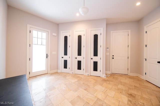 foyer entrance with a healthy amount of sunlight