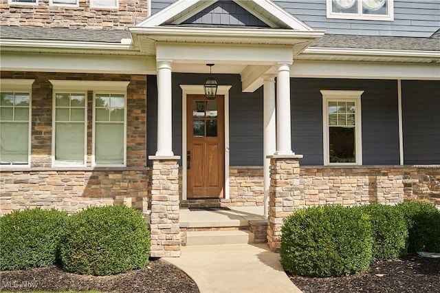 doorway to property featuring a porch