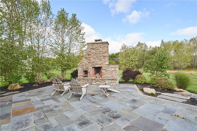 view of patio / terrace with an outdoor stone fireplace