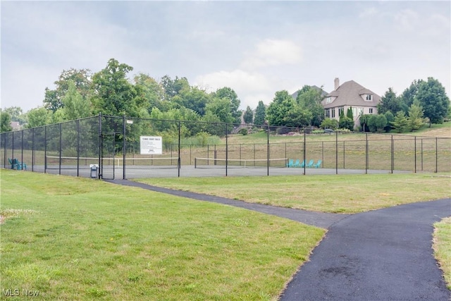 view of sport court with a yard and tennis court