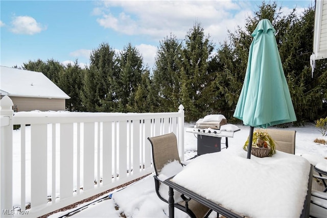 snow covered patio featuring grilling area