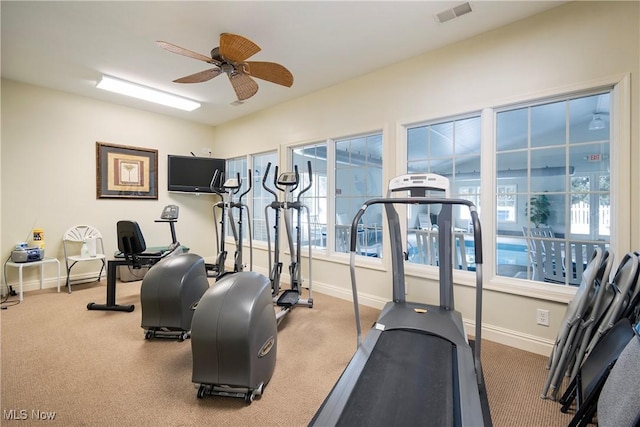 exercise room with ceiling fan