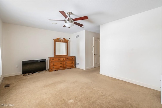 unfurnished bedroom featuring ceiling fan and light carpet