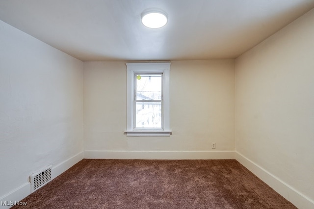 spare room featuring carpet flooring