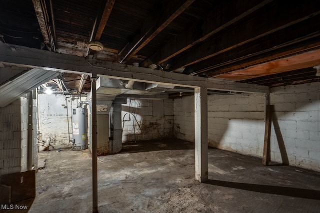 basement featuring gas water heater and heating unit