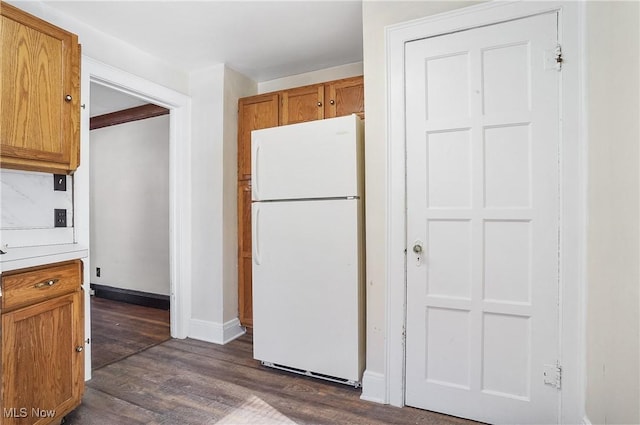 kitchen featuring dark hardwood / wood-style flooring and white refrigerator