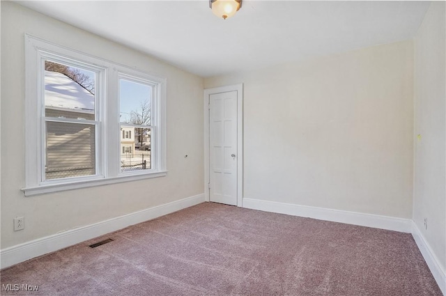 empty room featuring carpet flooring