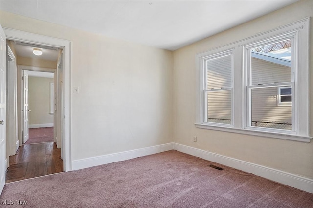 spare room featuring carpet floors