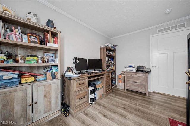 office space featuring hardwood / wood-style floors, a textured ceiling, and crown molding