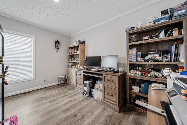 office area with light wood-type flooring, a textured ceiling, and ornamental molding