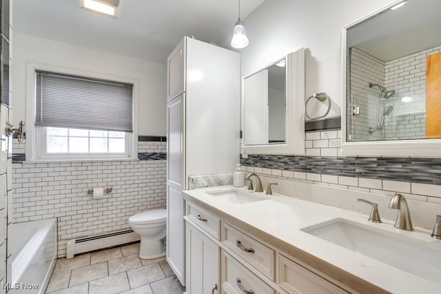 full bath with baseboard heating, toilet, tiled shower, and a sink