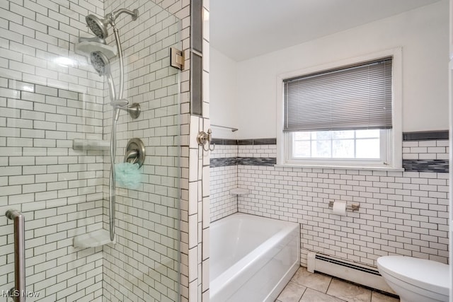 bathroom with toilet, a garden tub, a stall shower, tile walls, and a baseboard radiator