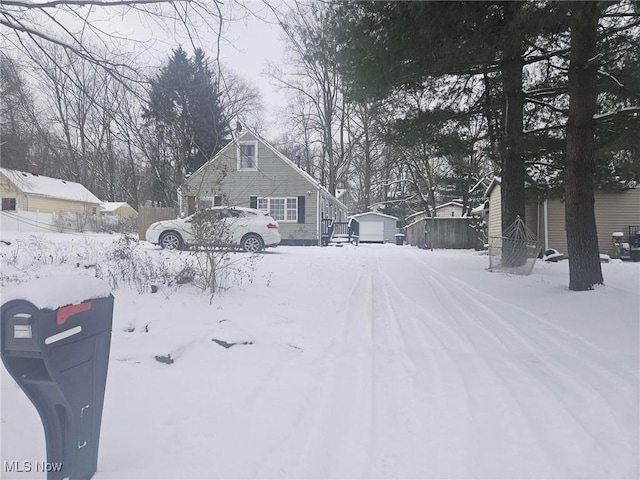 yard covered in snow with an outdoor structure