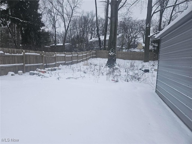 view of yard layered in snow