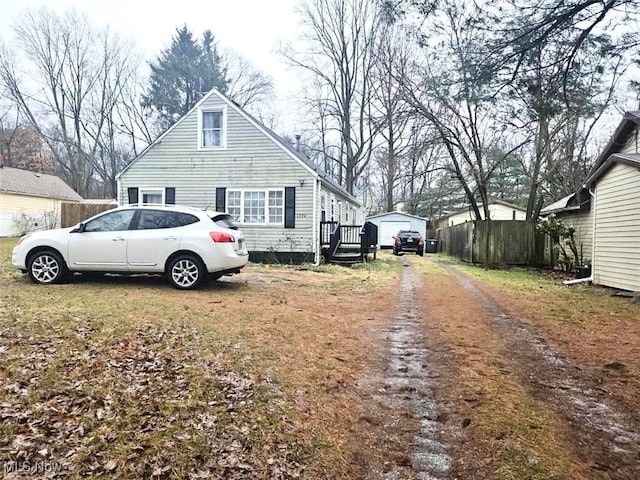 view of home's exterior featuring an outbuilding and a garage