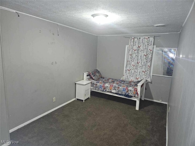 carpeted bedroom with a textured ceiling