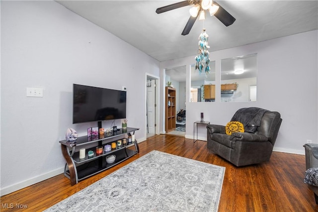 living room with ceiling fan and dark hardwood / wood-style floors