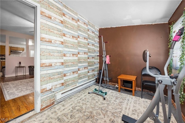 workout area with hardwood / wood-style floors