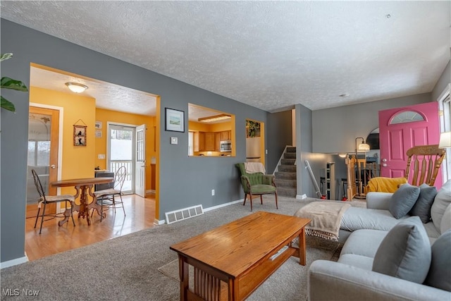 living room with a textured ceiling