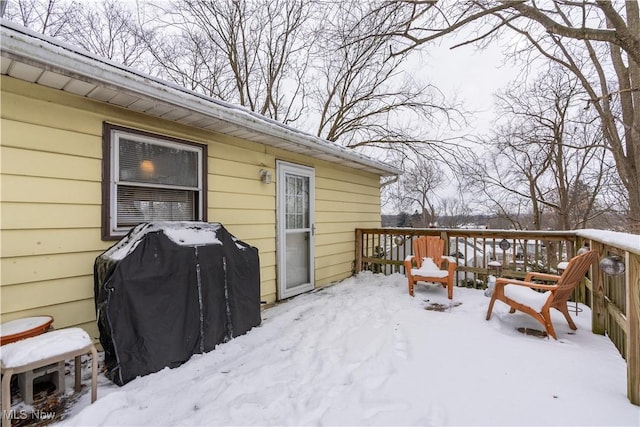 snow covered deck featuring area for grilling