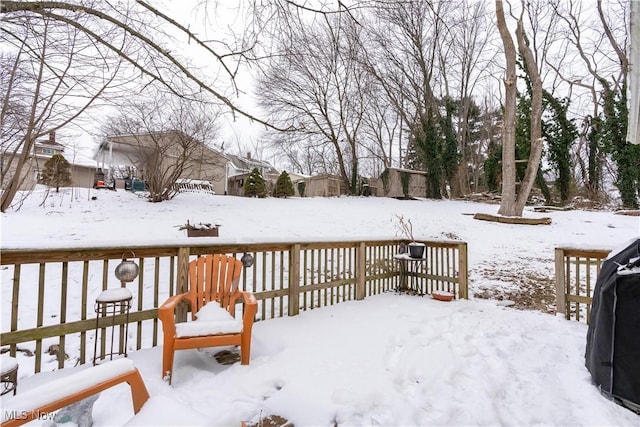 view of snow covered deck