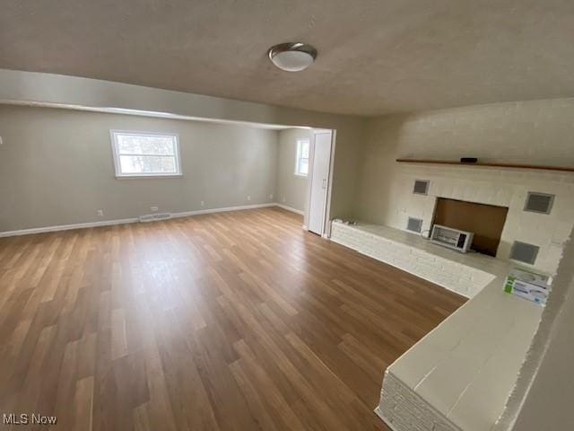 living room with wood-type flooring and a wealth of natural light