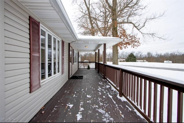 view of snow covered deck