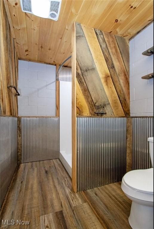 bathroom featuring wood ceiling, toilet, and wood finished floors