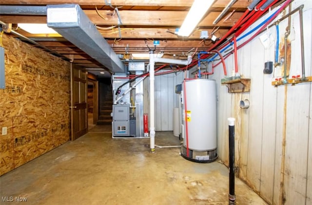 unfinished basement with water heater and heating unit