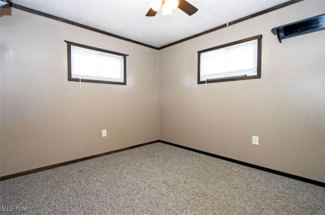 unfurnished room with baseboards, plenty of natural light, ornamental molding, and carpet flooring