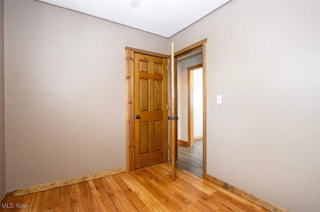 spare room with light wood-style floors