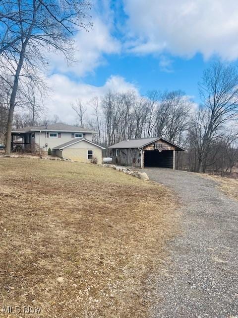 view of side of home with driveway