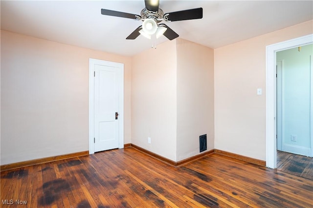 unfurnished room with dark hardwood / wood-style floors and ceiling fan