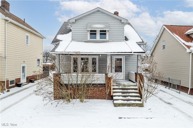 view of snow covered house