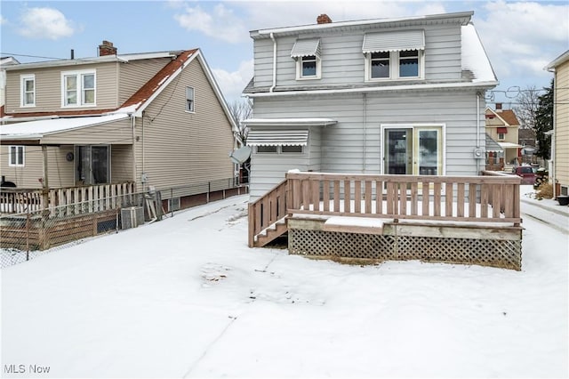 view of snow covered house