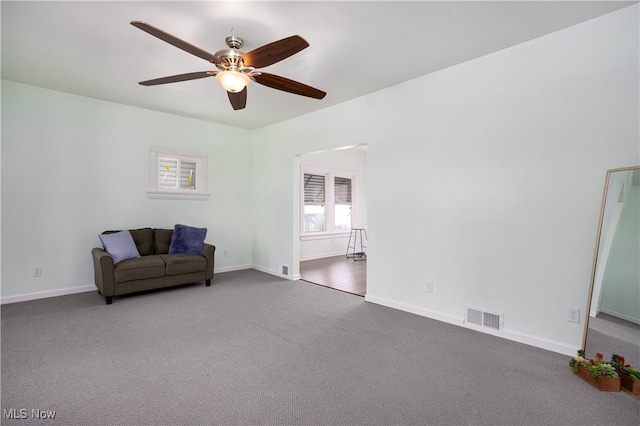 sitting room with carpet and ceiling fan