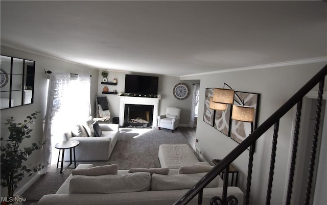 carpeted living room with ornamental molding