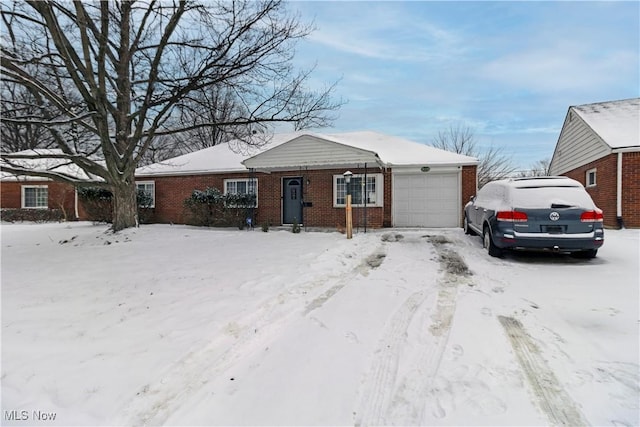 single story home featuring a garage