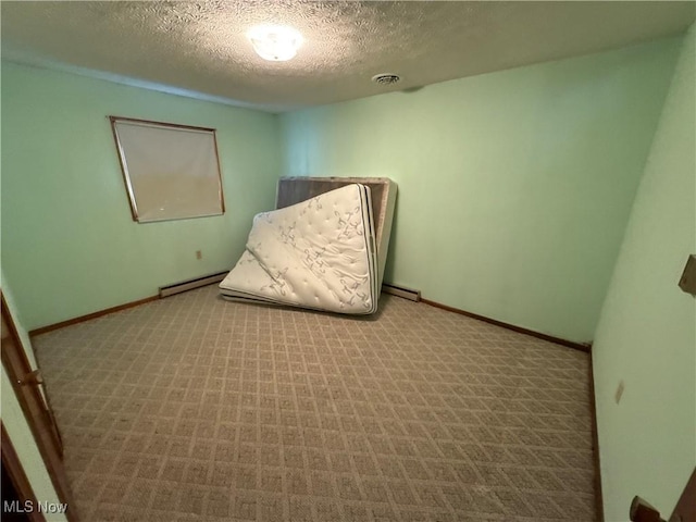 unfurnished bedroom featuring a textured ceiling, light carpet, and a baseboard radiator