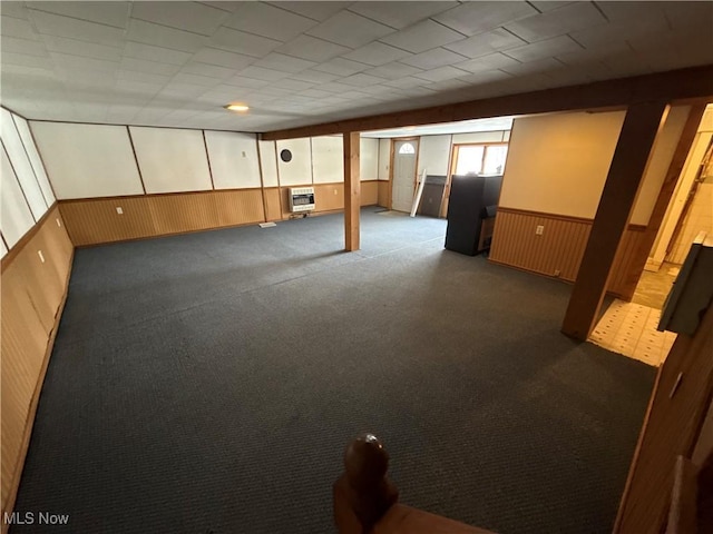 basement with heating unit and carpet floors